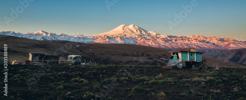 farm herdsmen on the background of mount Elbrus at sunrise. The highest point in Europe 5642m.