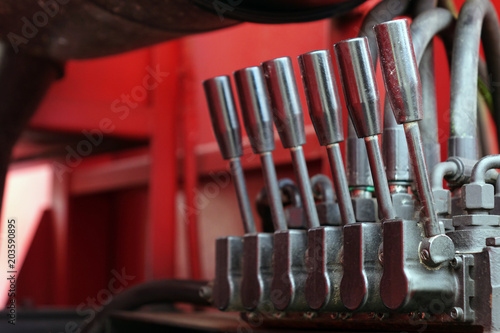 Levers on the control panel of the lifting mechanism.
