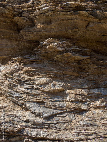 Stone background, rock wall backdrop with rough texture