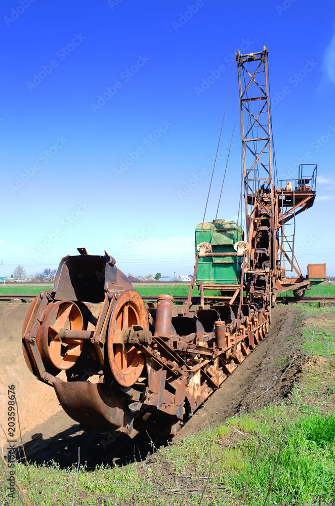 old bucket excavator of transverse dripping conducts the development of a quarry and extraction of clay old bucket excavator of transverse dripping conducts the development of a quarry and extraction of clay
