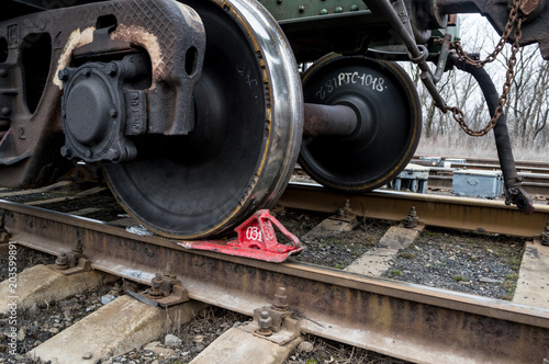 Railway brake Shoe or for keeps on the rails of the railway car. Iron wheels . Metal rails.