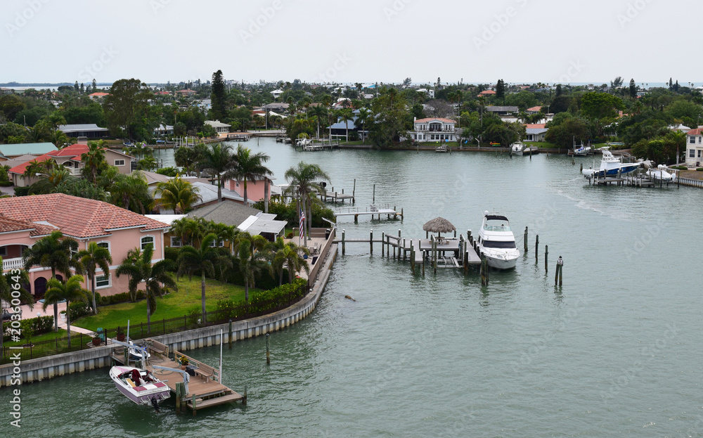 Waterfront homes with docks and boats, Florida.