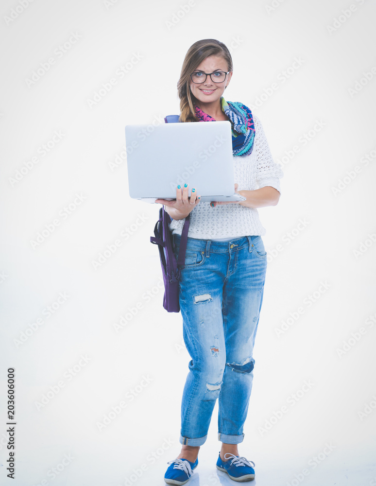 Smiling teenager with laptop on white background. Student. Smiling teenager with laptop on white background. Student.