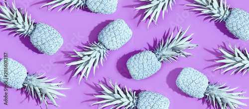 Painted pineapples on a vivid purple background