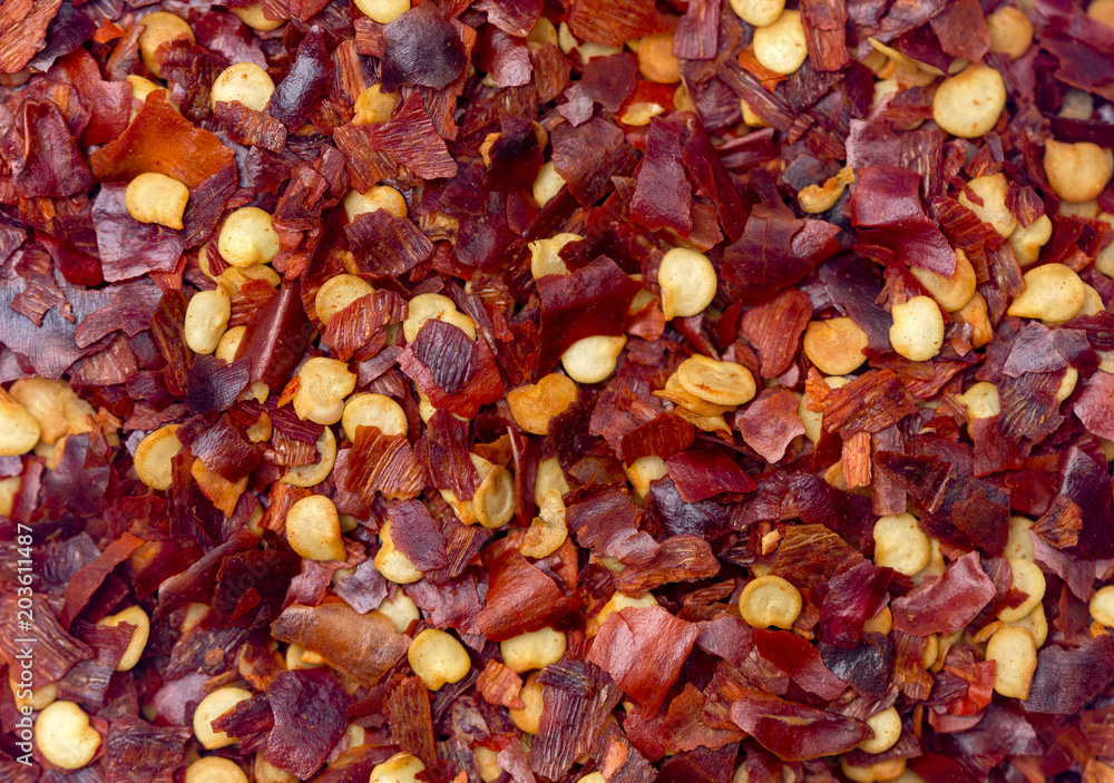 A Background of Crushed Red Pepper Flakes A Background of Crushed Red Pepper Flakes