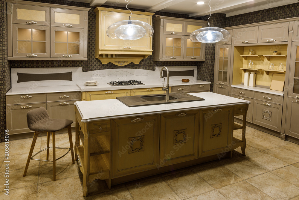 Interior of modern kitchen with beige cabinets Interior of modern kitchen with beige cabinets