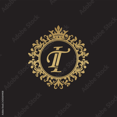 Initial letter IT, overlapping monogram logo, decorative ornament badge, elegant luxury golden color