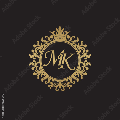 Initial letter MK, overlapping monogram logo, decorative ornament badge, elegant luxury golden color photo