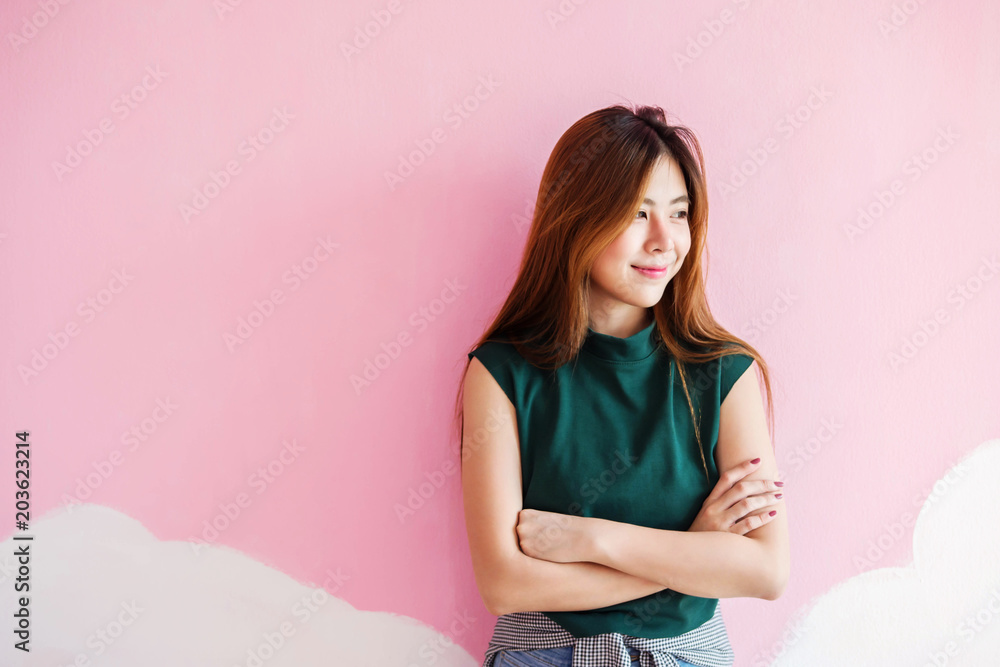 Portrait of Young Woman, Looking Outside with Charming Smile, Crossed Arms Portrait of Young Woman, Looking Outside with Charming Smile, Crossed Arms