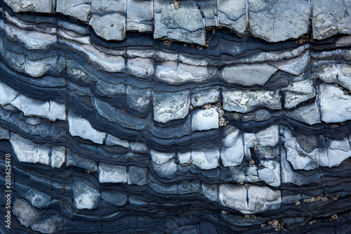 Tableau sur toile Multistory layered rough and sedimentary rocks in famous tourist site Chaeseokgang Coast in Buan-gun, South Korea