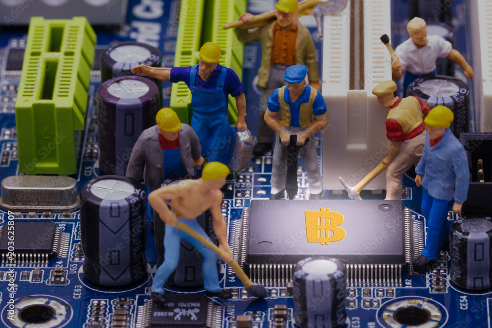 Fototapeta premium little miner is digging for bitcoin with graphic card. conceptual image for bitcoin mining and crypto currency.
