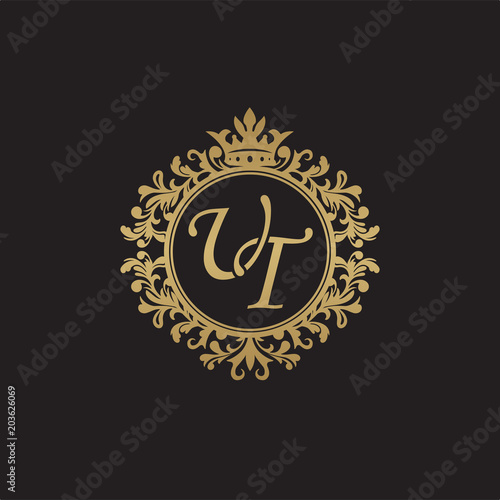 Initial letter UT, overlapping monogram logo, decorative ornament badge, elegant luxury golden color