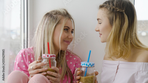 friendship bff communication conversation. girls talking drinking a beverage. best mates lifestyle