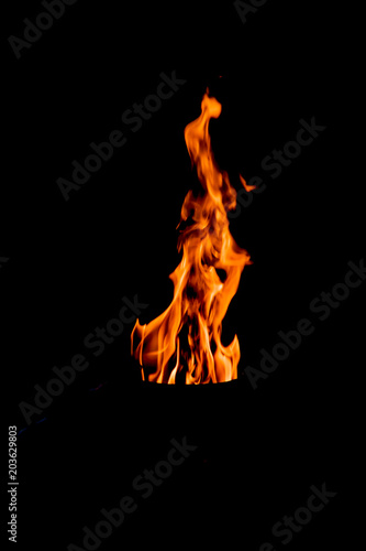 Natural fire, yellow-red flames on a black background  © golubka57