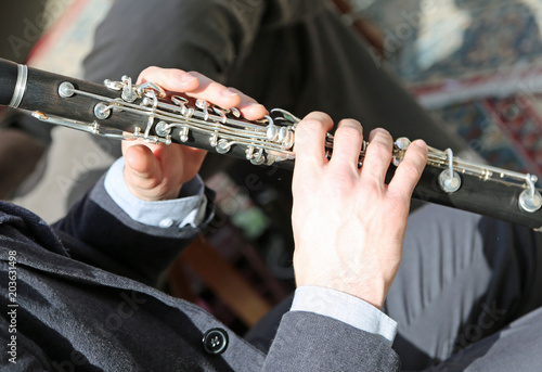 two hands of a skill flute player