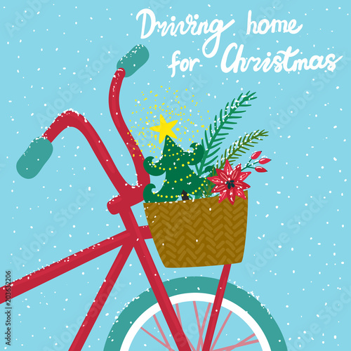 Vector holiday card with red bicycle, christmas tree in basket, snow and hand written text "Driving home for Christmas". Beautiful winter background.