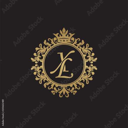 Initial letter XL, overlapping monogram logo, decorative ornament badge, elegant luxury golden color