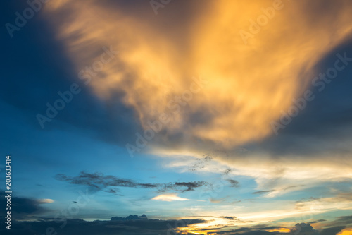 blue sky background texture with white clouds sunset. © Thinapob