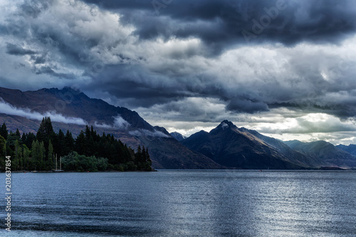 Dramatic evening sky over the mountains and lake Wakatipu in New Zealand