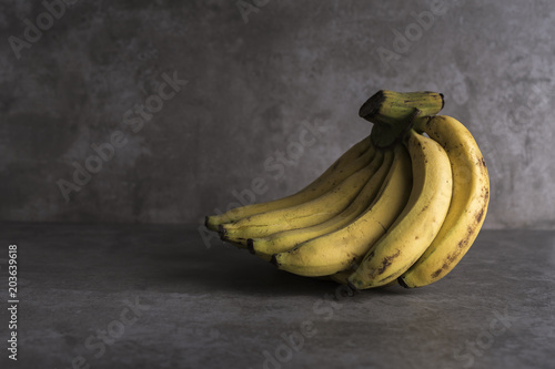 Bananas on grey kitchen table