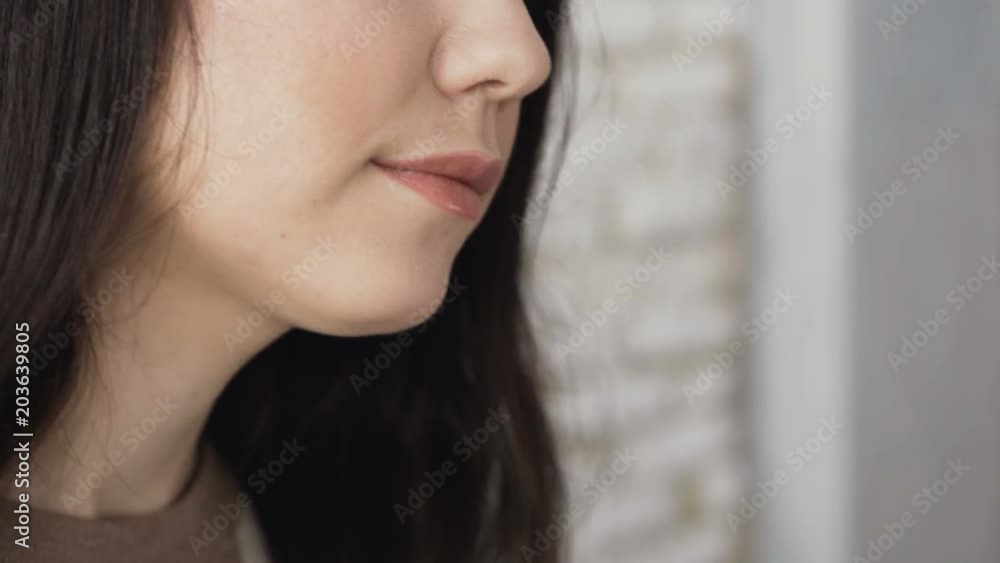 The profile of a girl artist who carefully paints on canvas face chart, using a brush and a palette of shadows. Creative work. Canvas stands on the easel. The make up artist draws at the easel The profile of a girl artist who carefully paints on canvas face chart, using a brush and a palette of shadows. Creative work. Canvas stands on the easel. The make up artist draws at the easel