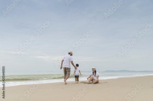 happy family with two kids on the beach, © aedkafl