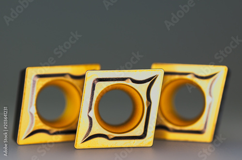 Valokuva Carbide inserts, detail closeup, isolated on grey.