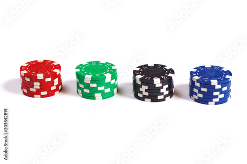 Four stacks of poker chips isolated on white background