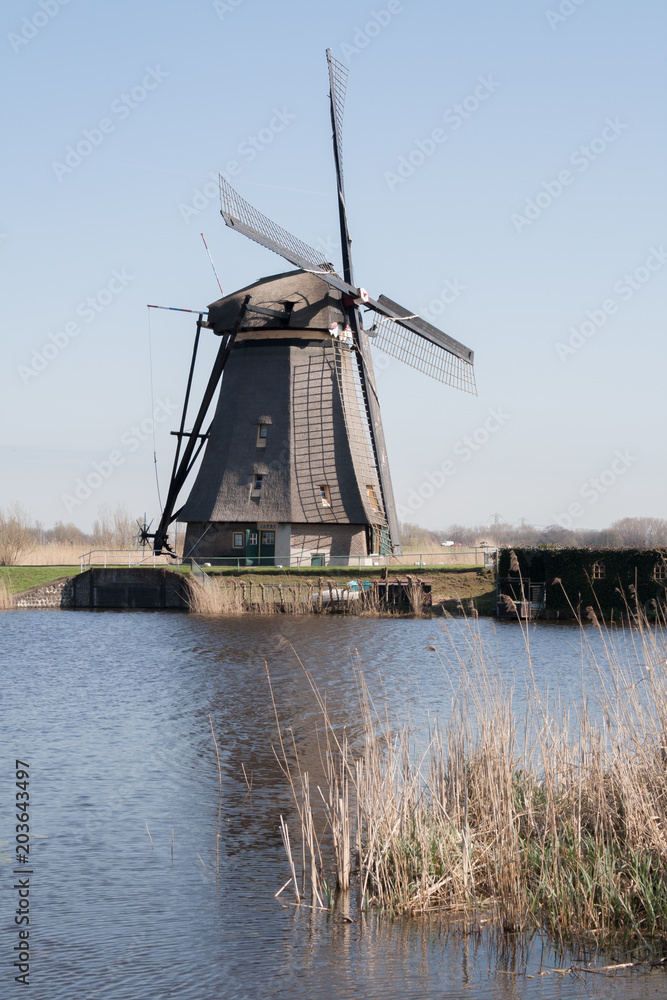 The Netherlands, dutch windmills landscape at Kinderdijk near Rotterdam, an UNESCO world heritage site The Netherlands, dutch windmills landscape at Kinderdijk near Rotterdam, an UNESCO world heritage site