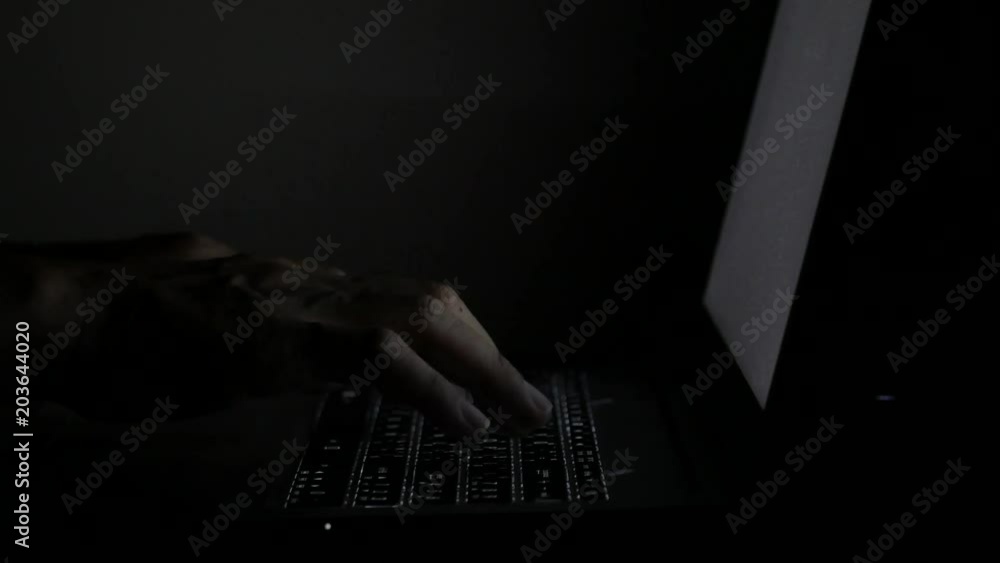 close up typing keyboard laptop computer black screen on the table in