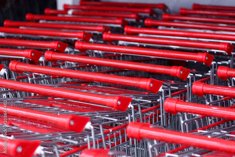 Supermarket shopping carts stacked in rows. Trolley Shopping Consumer Retail Business concept Supermarket shopping carts stacked in rows. Trolley Shopping Consumer Retail Business concept