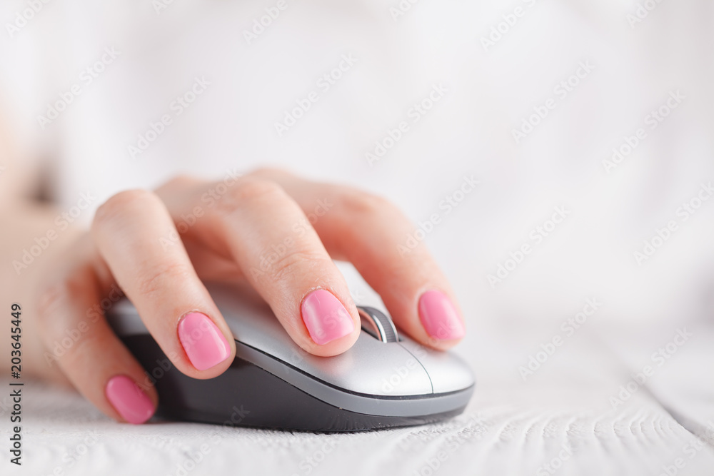 Close-up of business woman hand with mouse. Shallow depth of field. Selective focus. Close-up of business woman hand with mouse. Shallow depth of field. Selective focus.