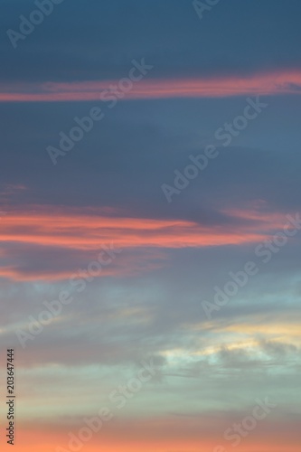 Nature background of vibrant colorful sunset clouds