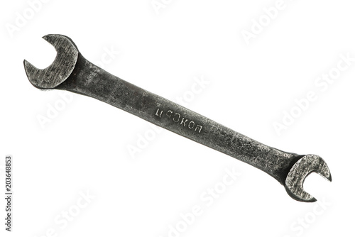 Old grungy wrench on white background. Isolated image of antiquare spanner.