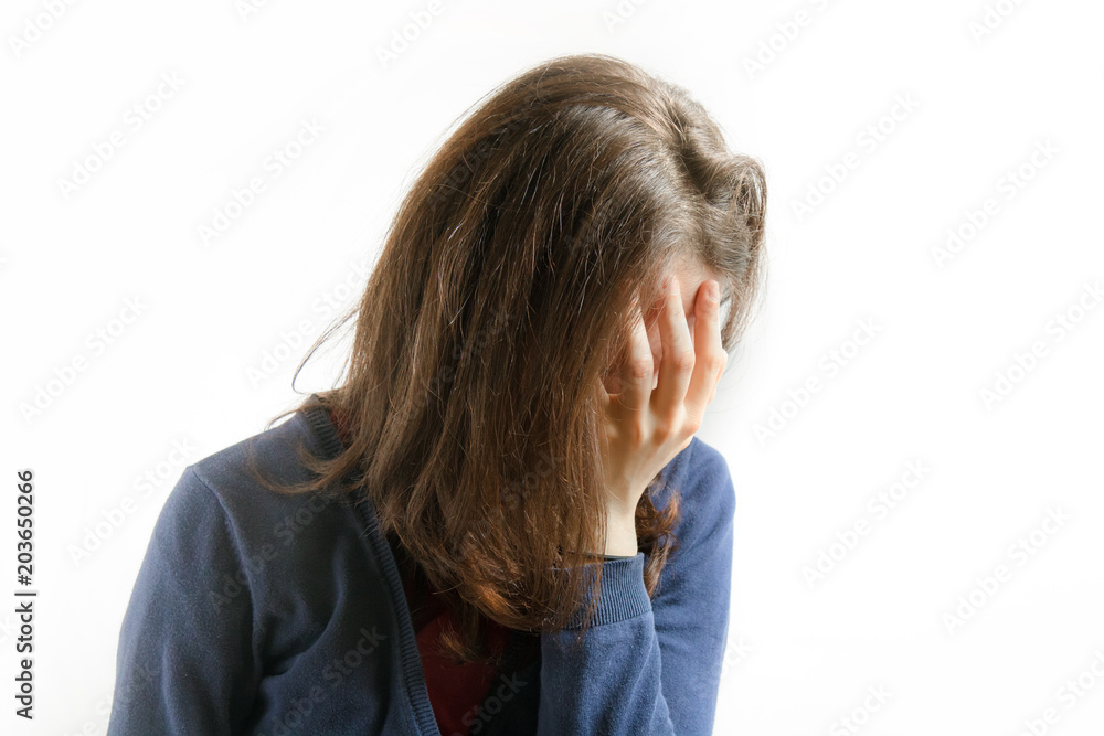 young woman covers her face, the model is on white background
young woman covers her face, the model is on white background