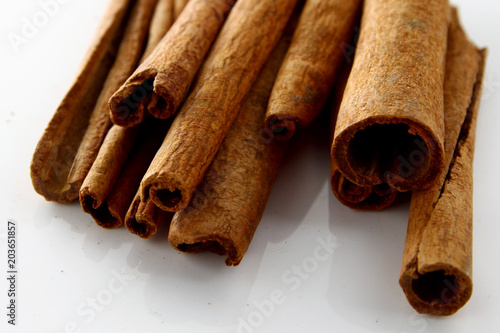 Cinnamon Stick / innamon is a spice commonly used in cooking that comes from the bark of the cinnamon tree. photo