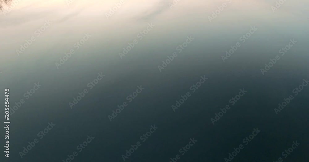 Aerial view dusk river. Golden and bleu hour sunset over the river Drone view over the golden sunset Beautiful Sunset Aerial Shot Fly over the river and sunset reys over the trees and branches Aerial view dusk river. Golden and bleu hour sunset over the river Drone view over the golden sunset Beautiful Sunset Aerial Shot Fly over the river and sunset reys over the trees and branches