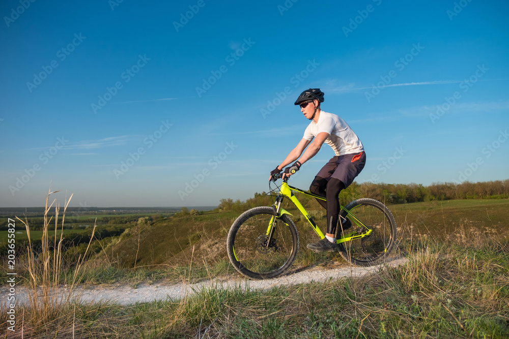 Mountain Bike cyclist riding single track outdoor. The concept of extreme sports.