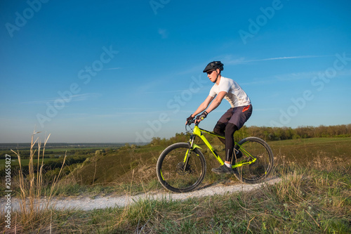 Mountain Bike cyclist riding single track outdoor. The concept of extreme sports.