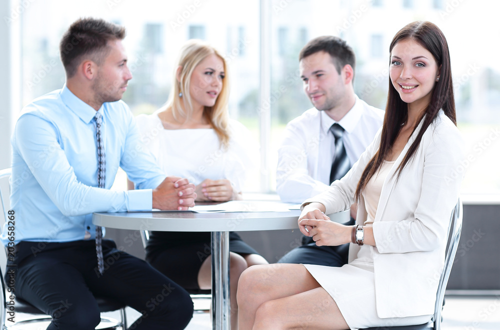 business team sitting at a table in a cafe, on a work break business team sitting at a table in a cafe, on a work break