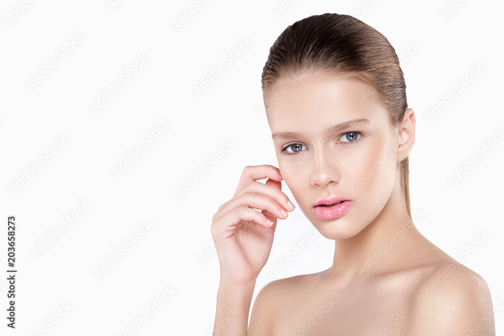 beauty of a woman's face. Natural makeup, pink lips, clean skin. Isolated white background.