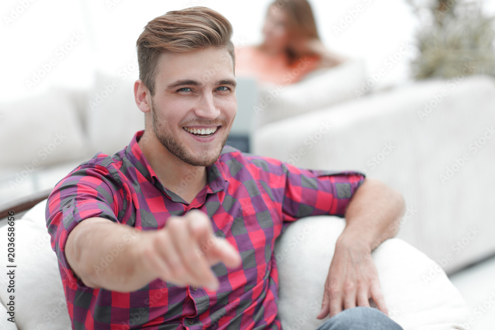 closeup of happy young man showing forward, closeup of happy young man showing forward,