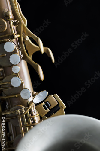 Fotografie Vintage saxophone on a black background