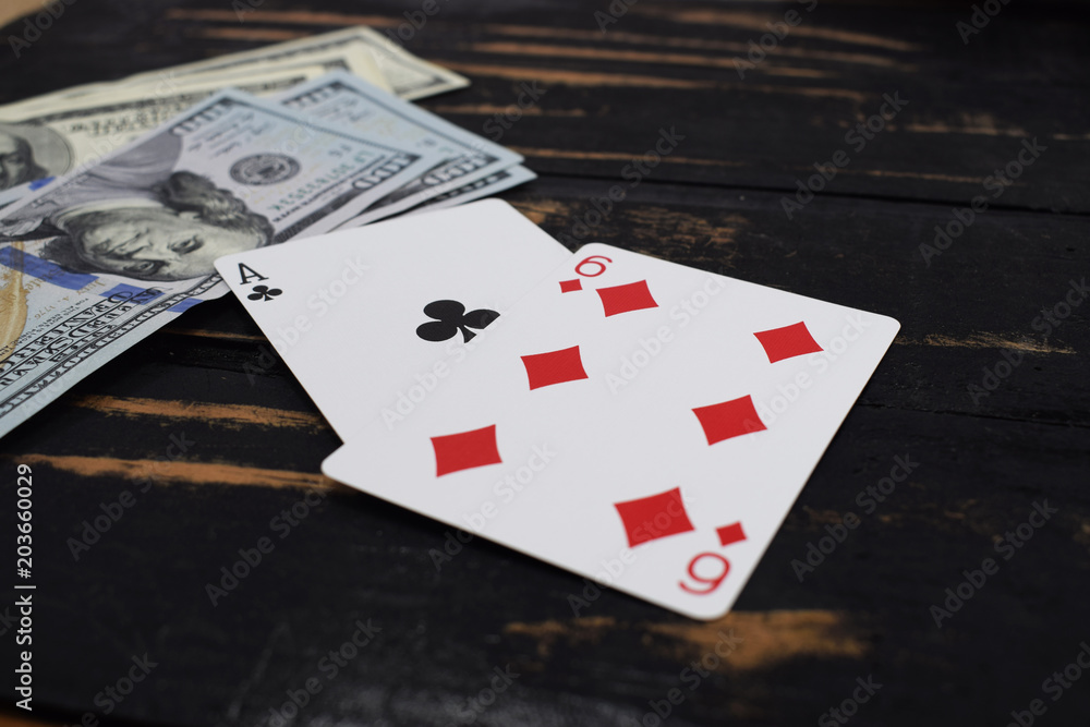 gambling, playing cards for money, on the table dollars and playing cards