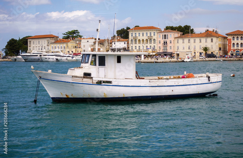 Small fishing boat in mediterranean harbor