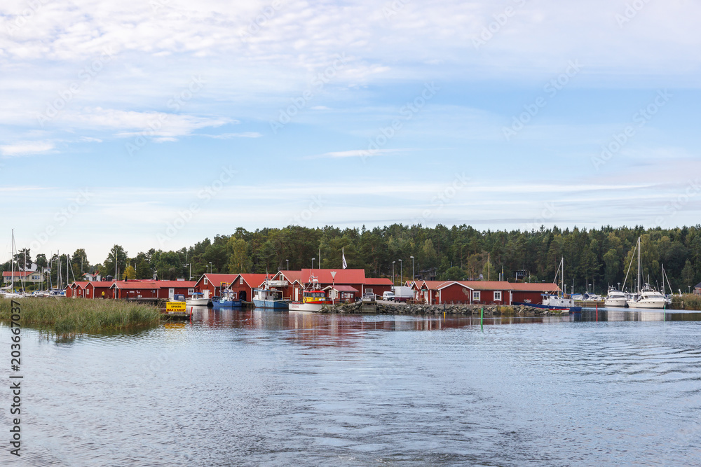 View from lake towards a fishing village in Lake Vanern in Sweden