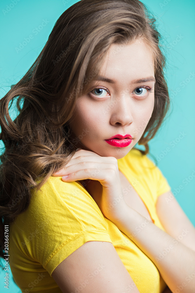 Beauty woman face portrait. Young girl with red lips piercing Beauty woman face portrait. Young girl with red lips piercing