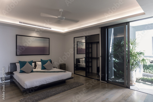 Panoramic view of nice white stylish modern bedroom