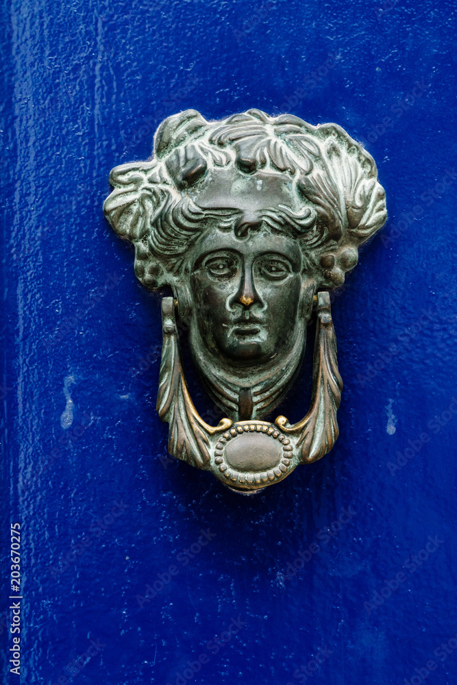Door Knocker on blue door