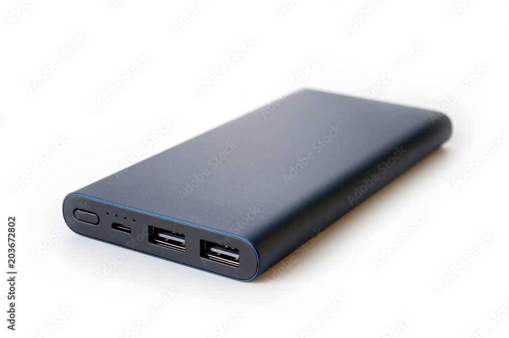 Powerbank new, powerful dark color with two usb inputs on a white background Powerbank new, powerful dark color with two usb inputs on a white background